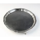 A George V silver salver by William Hutton & Sons, Sheffield 1925, of circular form with shaped