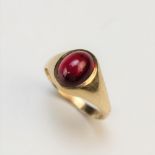 A ruby set dress ring, the central untested oval cabochon ruby