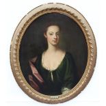 Circle of Sir Godfrey Kneller (1646-1723), Portrait of a young lady, half length, wearing a green