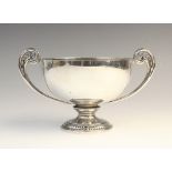 A George V twin-handled silver pedestal dish by Deakin & Francis, Birmingham 1924, of circular