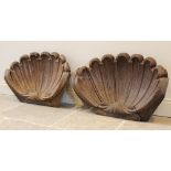 A pair of 19th century carved oak clam shell architectural spandrels, each of typical scalloped