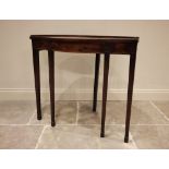 An unusual George III, serpentine fronted, mahogany demi-lune console table, raised on four fore-