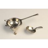 A George V silver tea strainer and stand by Cooper Brothers & Sons Ltd, Sheffield 1937, the strainer