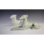 Two Pirkenhammer Czechoslovakian Borzoi or Saluki dogs, each modelled recumbent, one white glazed,