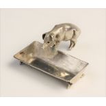 A novelty silver open salt, Chester circa 1900, realistically modelled as a pig and trough, the