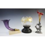A Victorian epergne or posy vase, mid 19th century, the single curved purple trumpet fitted to a