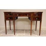 A George III style, early 20th century, mahogany cross banded serpentine sideboard, with central