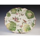 A Chelsea style ?Hans Sloan? dish, of oval form with shaped rim, relief moulded with leaves and