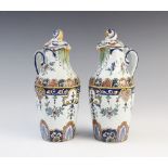 A pair of French faience cruets for oil and vinegar, 19th century, each tin-glazed earthenware