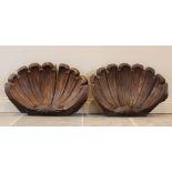 A pair of 19th century carved oak clam shell architectural spandrels, each of typical scalloped