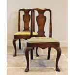 A pair of Queen Anne walnut side chairs, each with a vase shaped splat over a tapestry drop in seat,