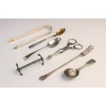 An assortment of silver cutlery, to include; a pair of George III silver sugar tongs, with shell