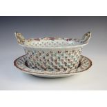 A Chinese export porcelain chestnut basket and stand, 18th century, decorated in famille rose and