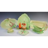 A Carlton ware novelty cruet set and stand, the salt modelled as a pea pod, the pepperette as a