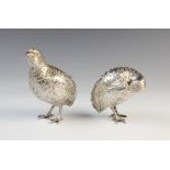 A pair of white metal grouse models, in the manner of Patrick Mavros, each realistically modelled