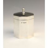 A George V silver tea caddy by Walker & Hall, Sheffield 1922, of octagonal form with hinged cover