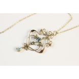 An Edwardian 9ct gold pendant, set with blue paste and simulated pearls to a scrolling wirework
