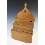 A Welsh pine provincial wall hanging spoon rack, 19th century, of traditional three tier design,