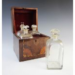 A George III mahogany and satinwood inlaid decanter case and four internal internal decanters, the