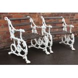 A pair of painted cast Coalbrookdale style garden chairs, stamped Rampley, hound and serpent design,