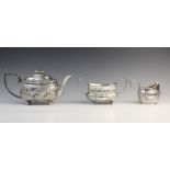 A 19th century silver associated tea service, comprising a teapot, sucrier and milk jug, all