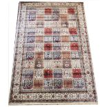 An ivory ground Kashmir carpet, with a traditional Persian garden panel design, full pile, 300cm x