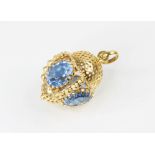 A Victorian style 18ct gold paste set fob charm, comprising four oval mixed cut blue paste, (each