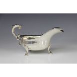 A George V silver sauce boat by Josiah Williams & Co, London 1922, of typical form with shaped rim