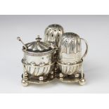 A Victorian silver condiment set on stand by Horace Woodward & Co Ltd, London 1896-8, comprising wet