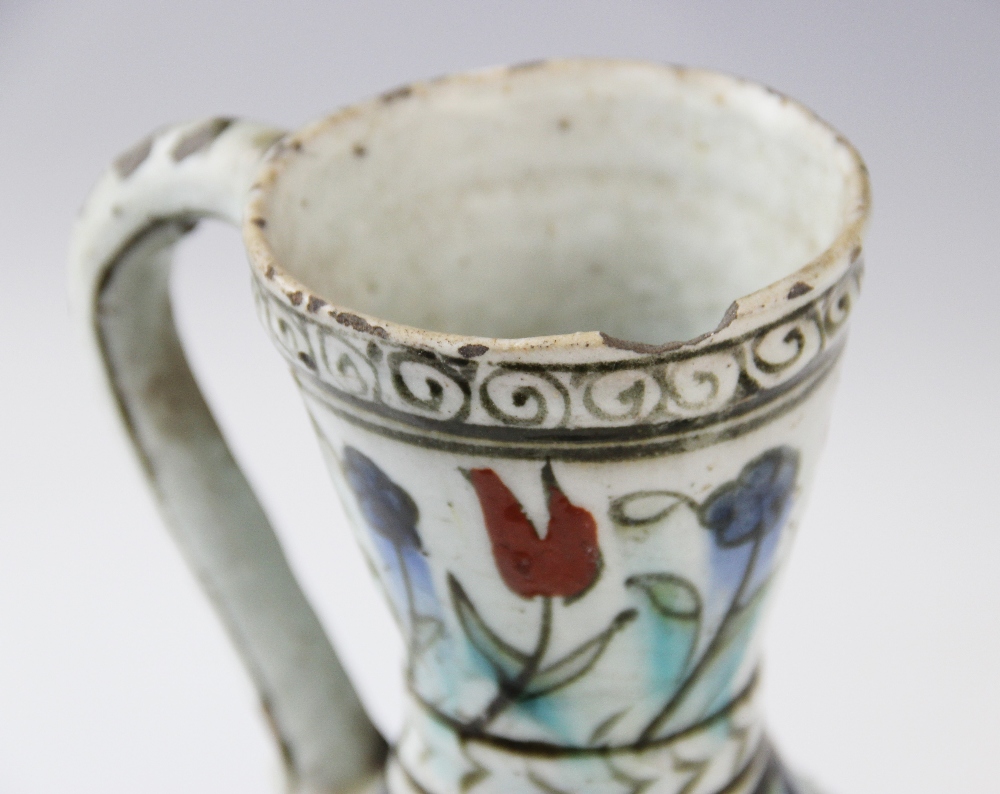 An Ottoman Empire Turkish polychrome pottery jug, of pear shape with attached handle and flared - Image 6 of 9