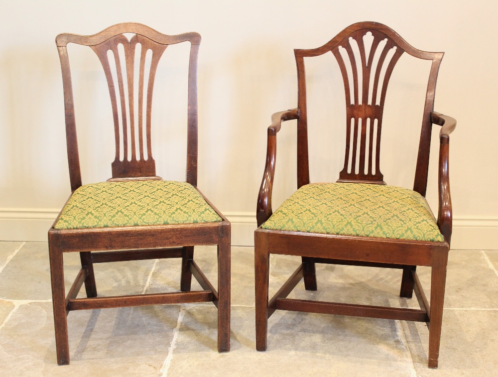 A set of seven George III mahogany Hepplewhite style dining chairs, each chair with a pierced - Image 3 of 3