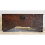 An early eighteenth century oak six plank coffer, the rectangular moulded top opening to an