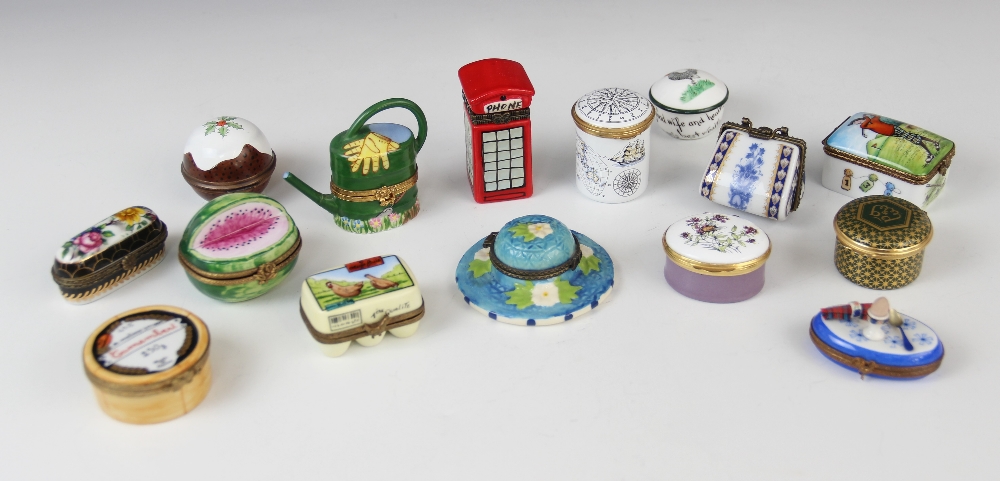 A collection of novelty pill boxes, 20th century, to include Staffordshire, Bilston and Battersea