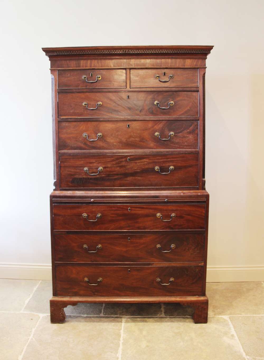 A George III mahogany chest on chest, the moulded cornice with a Greek key pattern frieze over two