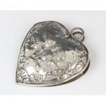 A Victorian silver desk clip by William Comyns, London 1896, in the shape of a heart decorated