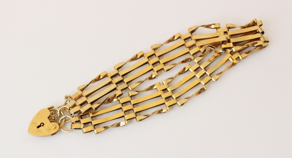A 9ct gold gate link bracelet, hallmarks for London 1982, 19cm long, suspending a 9ct gold heart- - Image 2 of 2