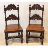 A pair of 17th century style oak Derbyshire side chairs, 20th century, each with a carved rung