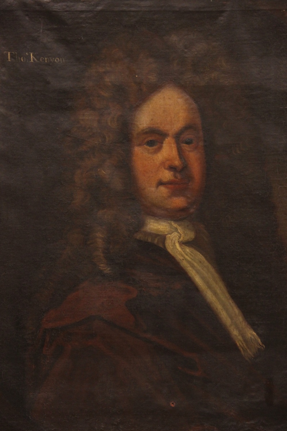 Follower of Michael Dahl (1659 -1743), Portrait of Thomas Kenyon of Peel Half length wearing a brown