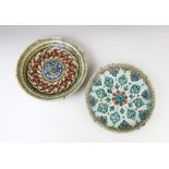 A collection of 17th century Ottoman Empire Turkish polychrome pottery wares, comprising; a charger,