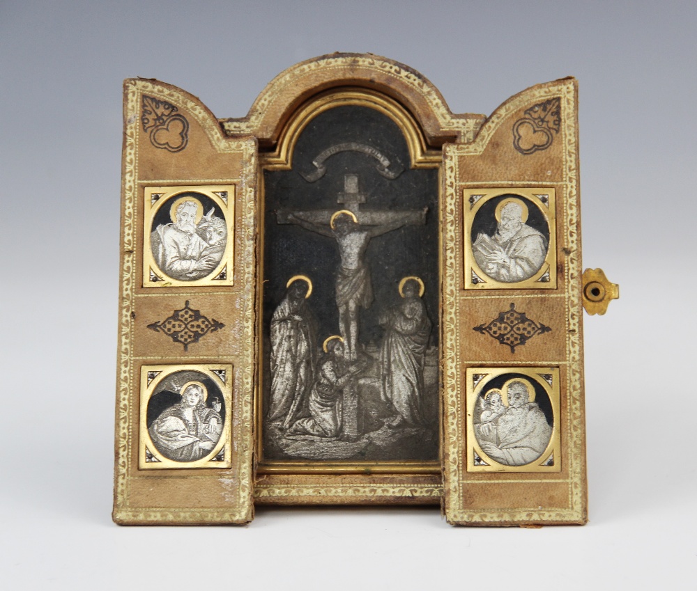 A silver gilt and Niello travelling triptych, 19th century, the central arched panel depicting the