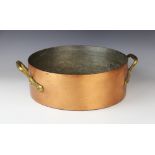 A copper saucepan of country house proportions, 19th century, with riveted brass handles, stamped '