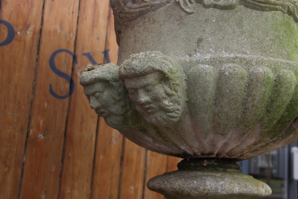 A reconstituted stone campana garden urn, of typical lobed form, moulded in relief with scrolling - Image 3 of 6