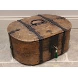 An elm and pine ship's box, 18th century, of oval form with hinged lid and lock, wrought iron