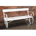 A 19th century painted iron and hardwood bench, the pair of scrolling strapwork supports united by a