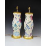 A pair of decoupage effect table lamps, probably Vaughan of Chelsea, of baluster form with turned