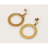 A pair of vintage 9ct gold drop earrings, each designed as a circular hoop with engine turned