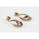 A pair of vintage diamond and ruby set 9ct gold earrings, each comprising two marquise shaped rubies