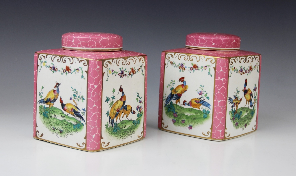 A pair of English porcelain tea caddies and covers, 20th century, each of square form, printed and