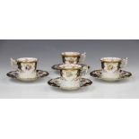 Four Coalport 'batwing' coffee cups and saucer, early 20th century, each piece decorated with gilt