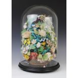 A Victorian floral shell display, mid 19th century, each flower created from layered shells with